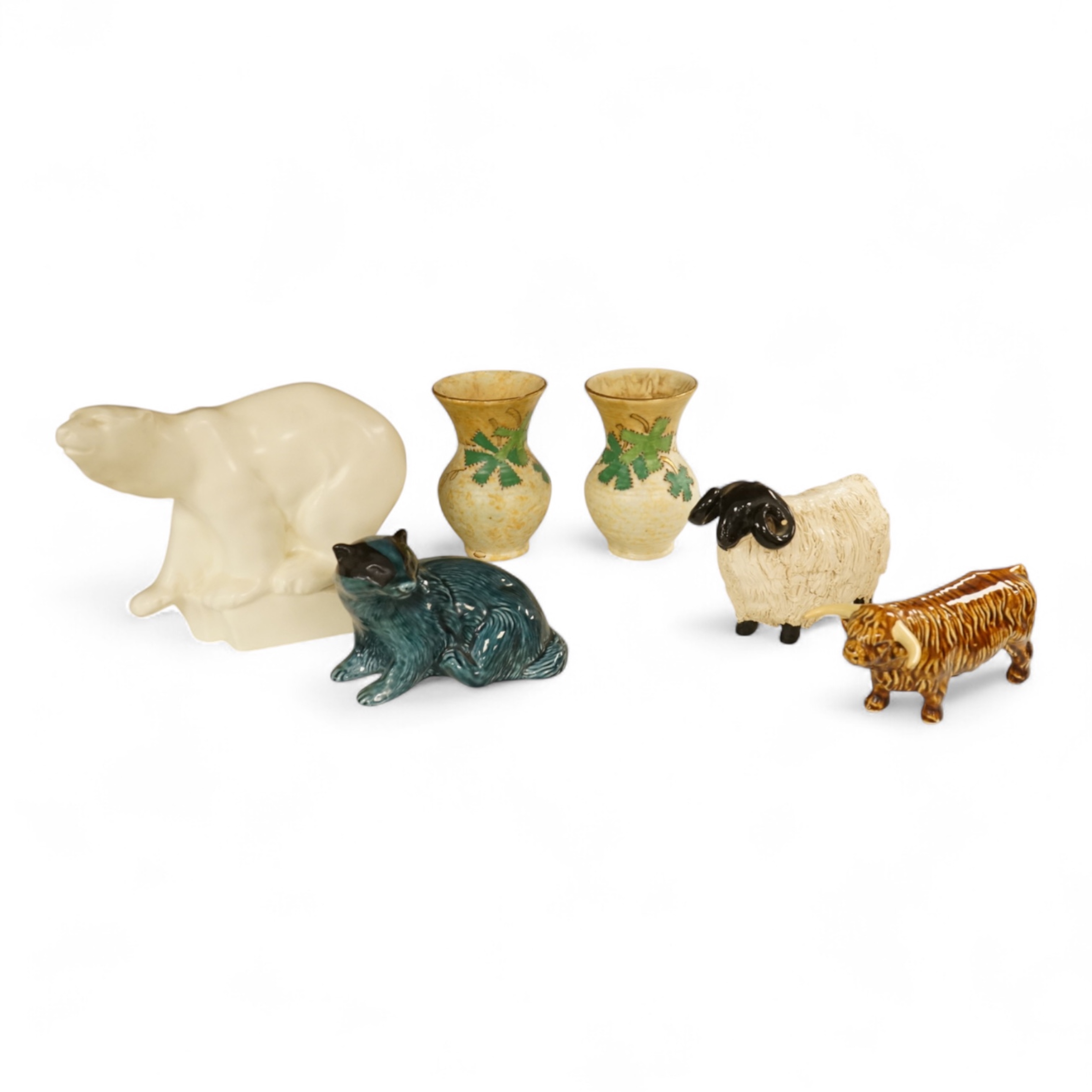 A Roy Smith Wedgwood polar bear, Poole pottery badger, Beswick bull and pig, together with other collectables, largest 17cm high